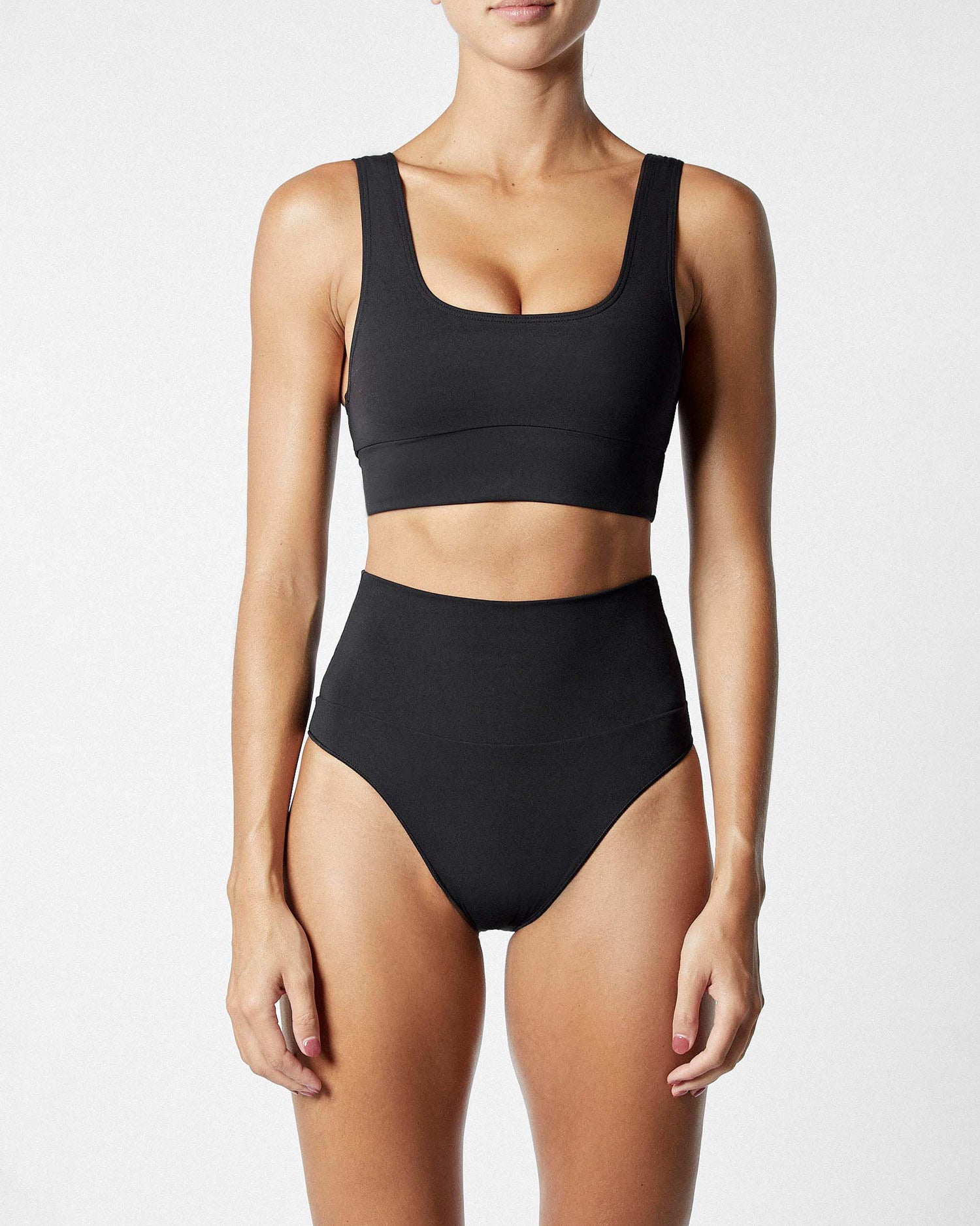 On body front of the Contour Crop Top - Black. 
